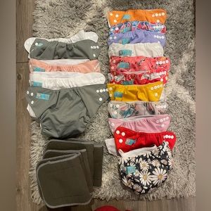 11 newborn size and 5 regular size Alva Baby diaper covers 6 charcoal inserts